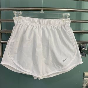 White Nike running shorts